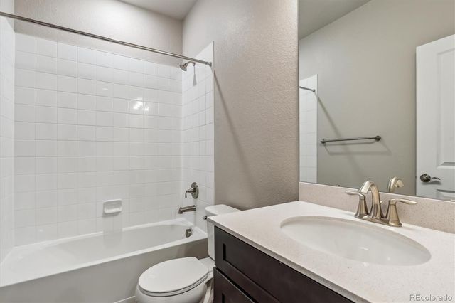 a bathroom with a sink a toilet and a bathtub
