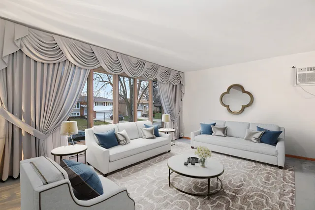 a living room with furniture a rug and a window