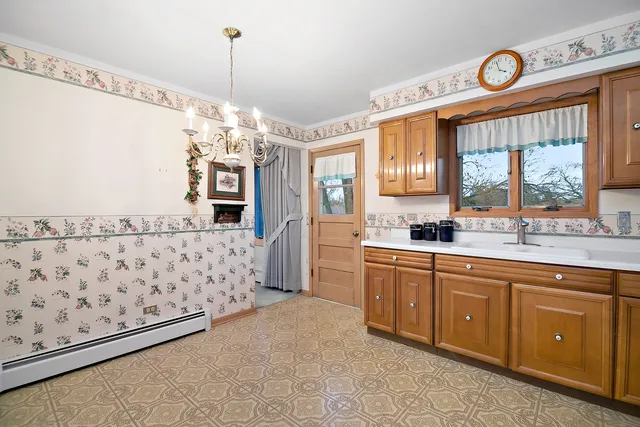 a spacious bathroom with a double vanity sink and a window
