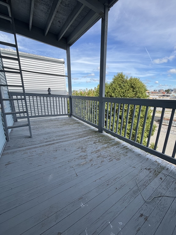 47 Middle Street Boston, MA 02127 - Photo 9 of 12 a view of balcony with wooden floor