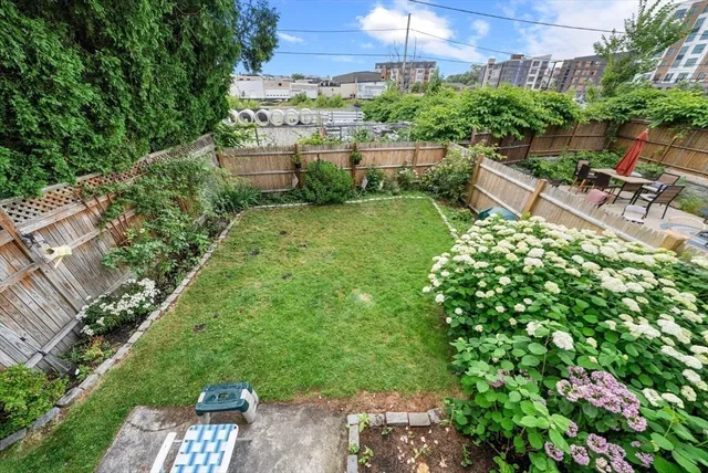 a view of a chairs and table in a yard