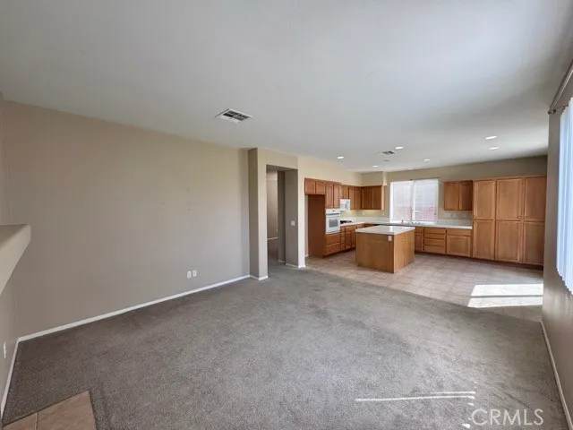 a view of a kitchen with a sink and cabinets
