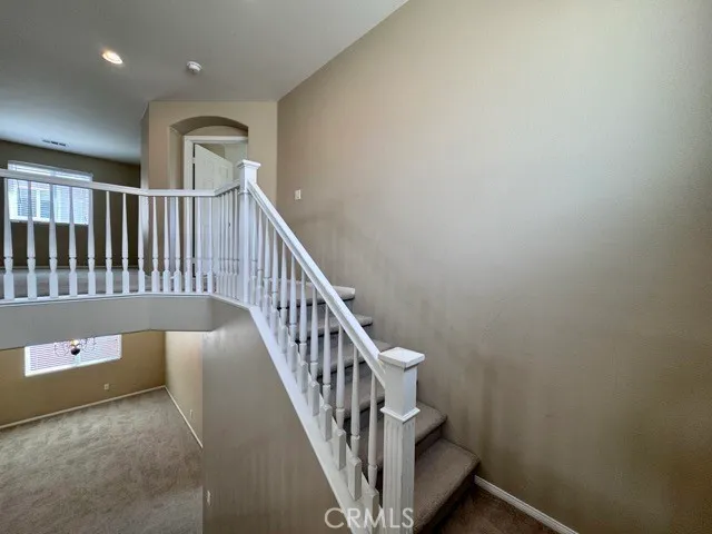 a view of entryway with stairs