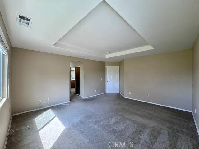 a view of hallway with a large mirror