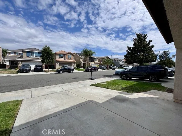 a view of street with parked cars