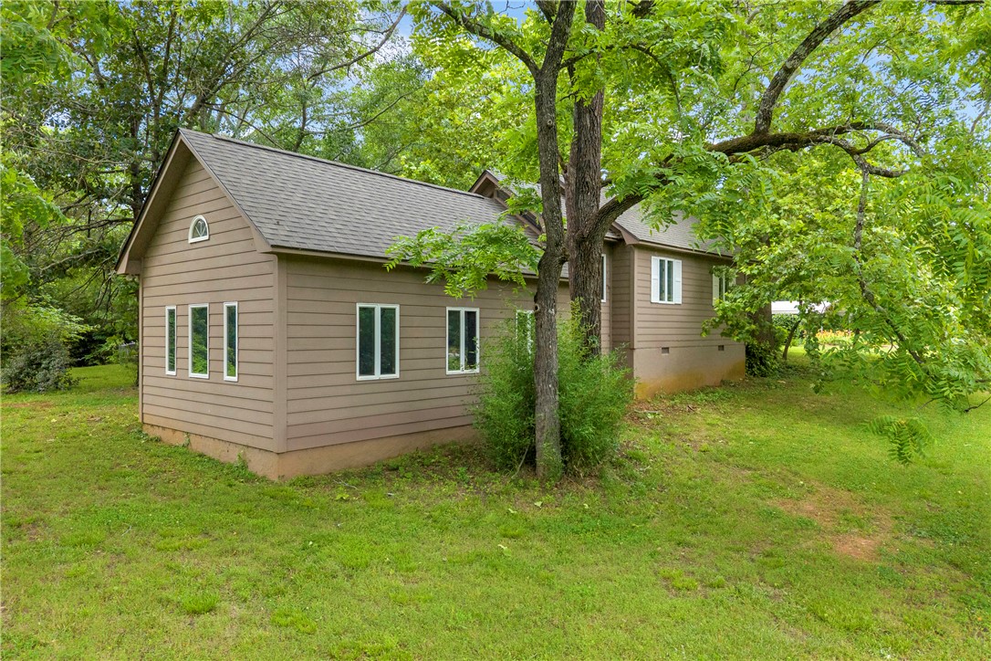 200 Chenault Road Townville, SC 29689 - Photo 30 of 47 A tranquil, tree-sheltered residence nestled on a verdant hillside.