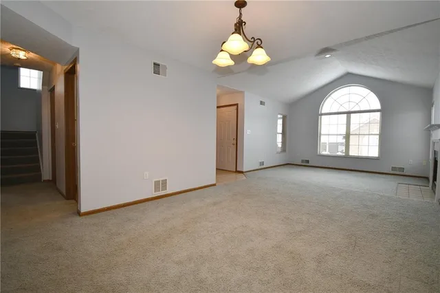 a kitchen with stainless steel appliances granite countertop a refrigerator microwave and sink