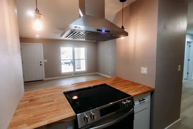 a view of an empty room with a window