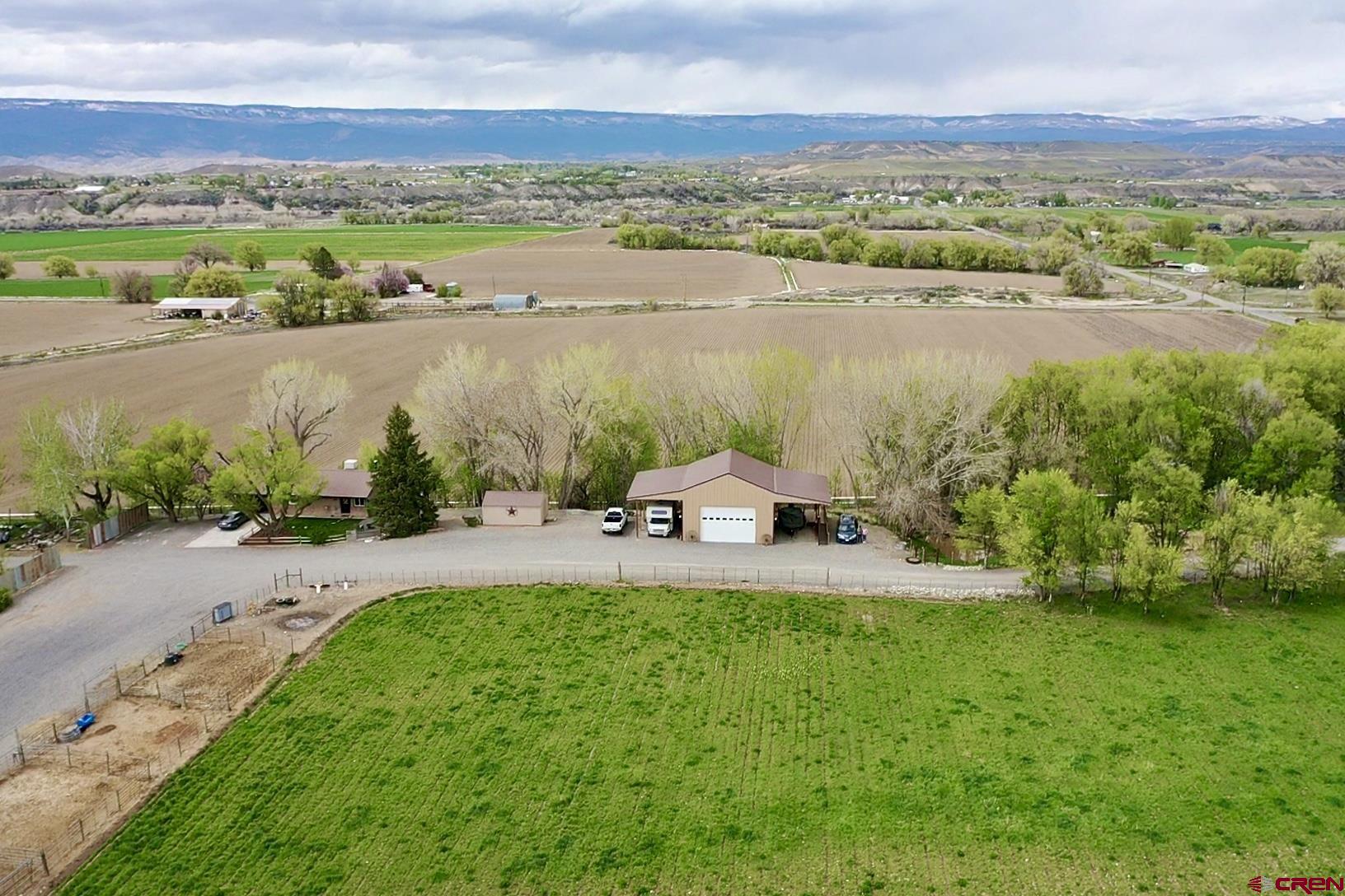 7571 2200th Road Delta, CO 81416 - Photo 1 of 35 a view of a lake with a yard and mountain view