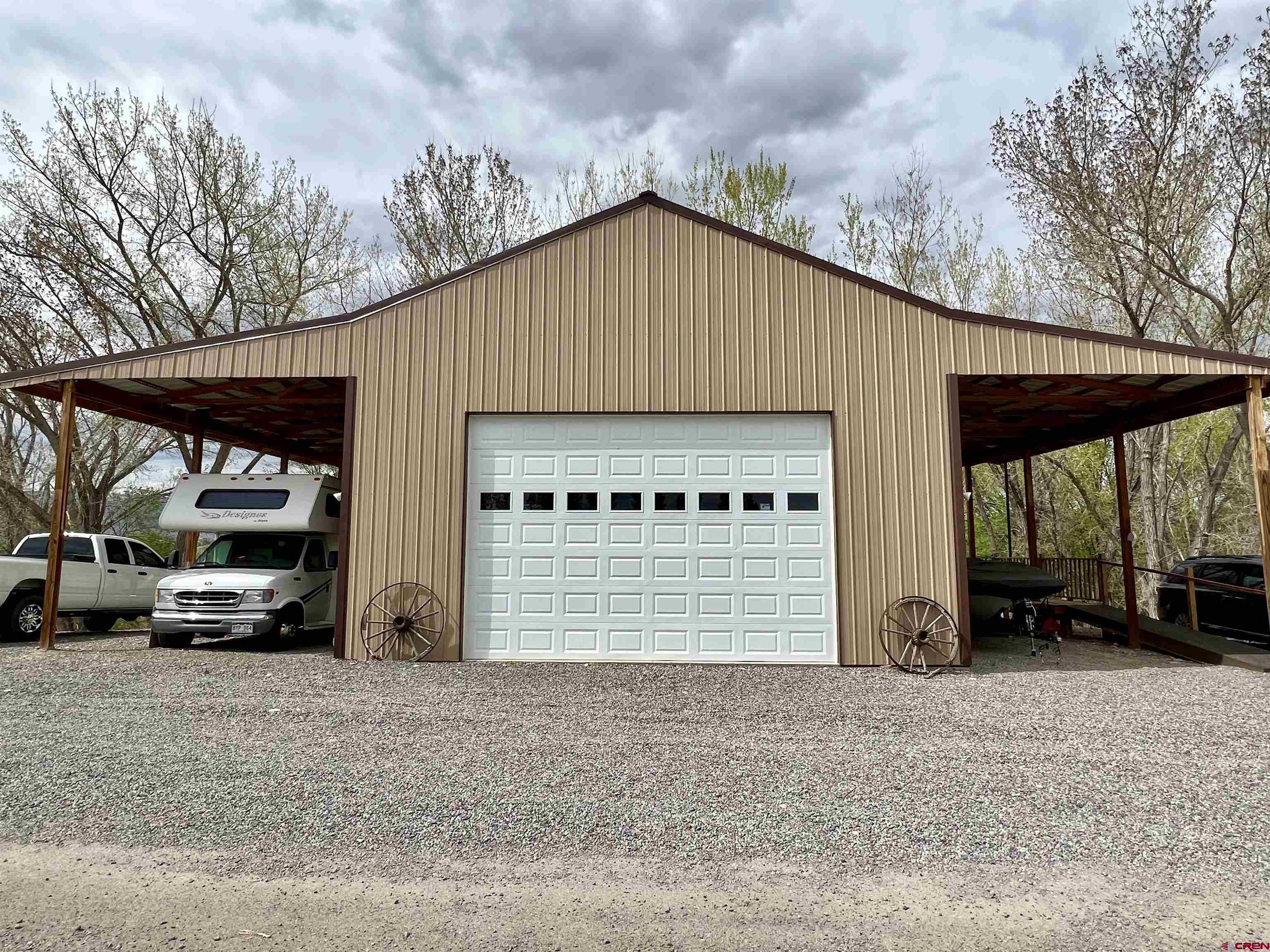 7571 2200th Road Delta, CO 81416 - Photo 31 of 35 a view of garage and car parked