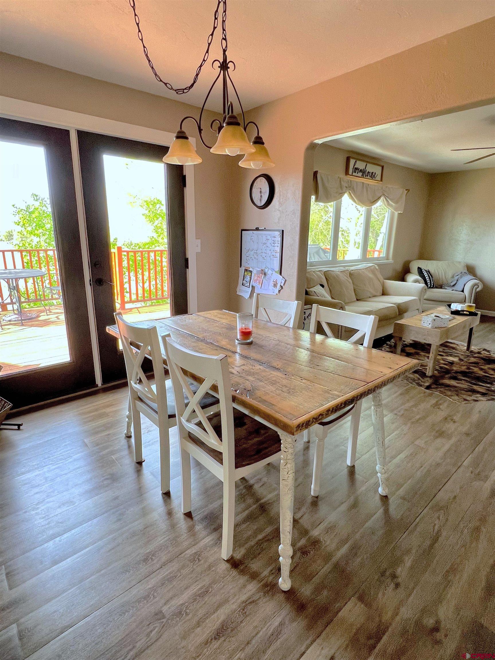7571 2200th Road Delta, CO 81416 - Photo 8 of 35 a view of a dining room with furniture window and wooden floor