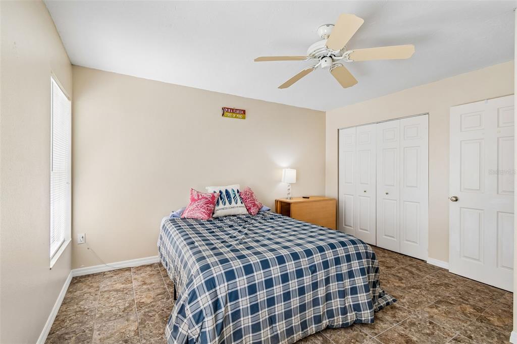 119 Burns Road Terra Ceia, FL 34250 - Photo 52 of 100 a bedroom with a bed and a chandelier