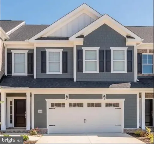 a front view of a house with a garage