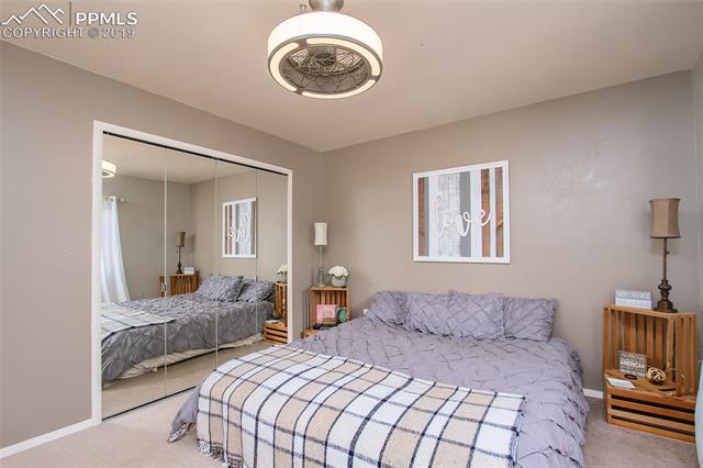 4827 Del Sol Road Colorado Springs, CO 80918 - Photo 10 of 24 The generous upper level master bedroom with en suite 3/4 bath.