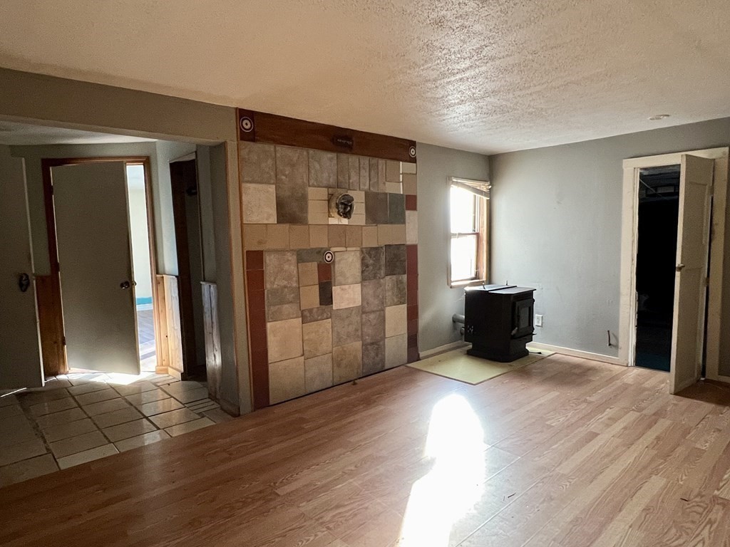 100 Main Road Colrain, MA 01340 - Photo 4 of 10 a view of livingroom with furniture and wooden floor