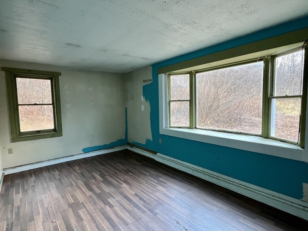 100 Main Road Colrain, MA 01340 - Photo 7 of 10 a room with a window and wooden floor
