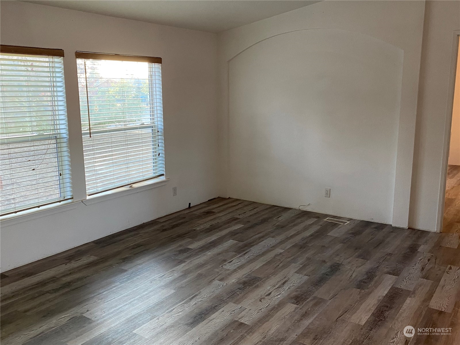 19220 Old Ranch Lane Southwest Rochester, WA 98579 - Photo 11 of 19 a view of empty room with wooden floor and fan
