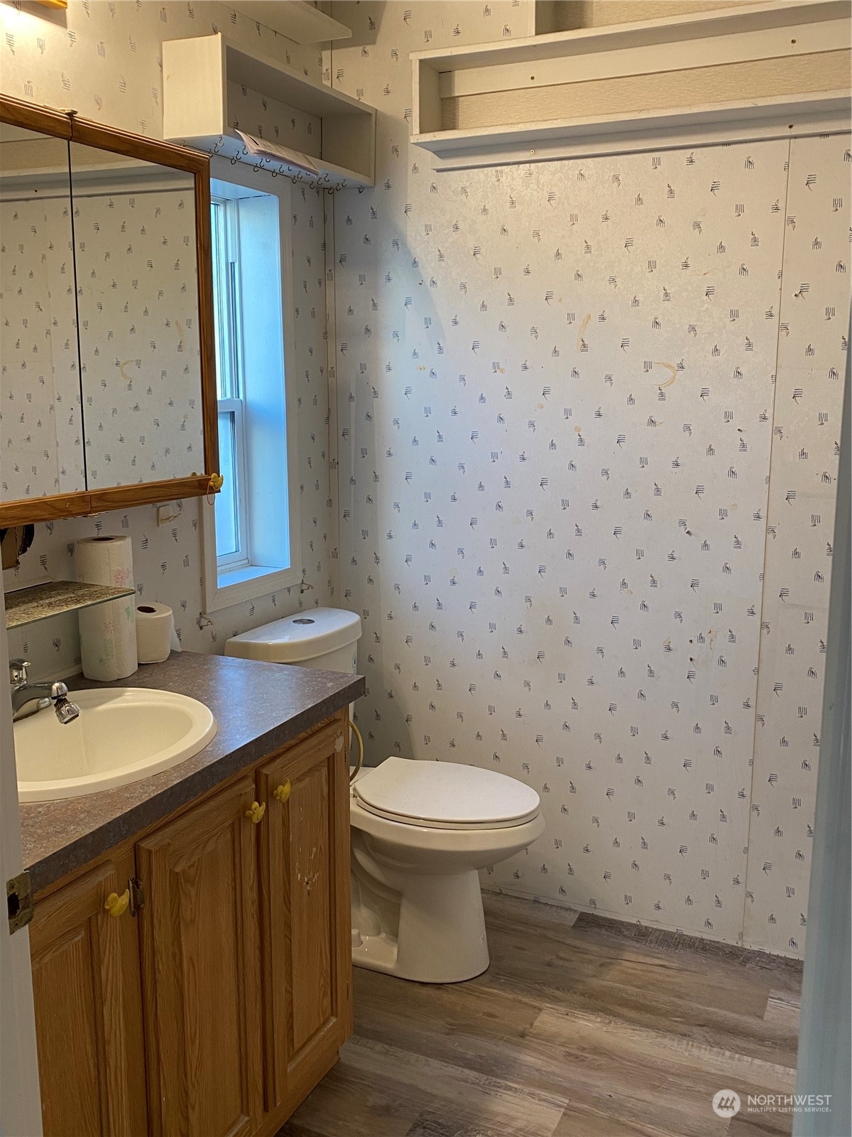 19220 Old Ranch Lane Southwest Rochester, WA 98579 - Photo 13 of 19 a bathroom with a granite countertop toilet and a sink