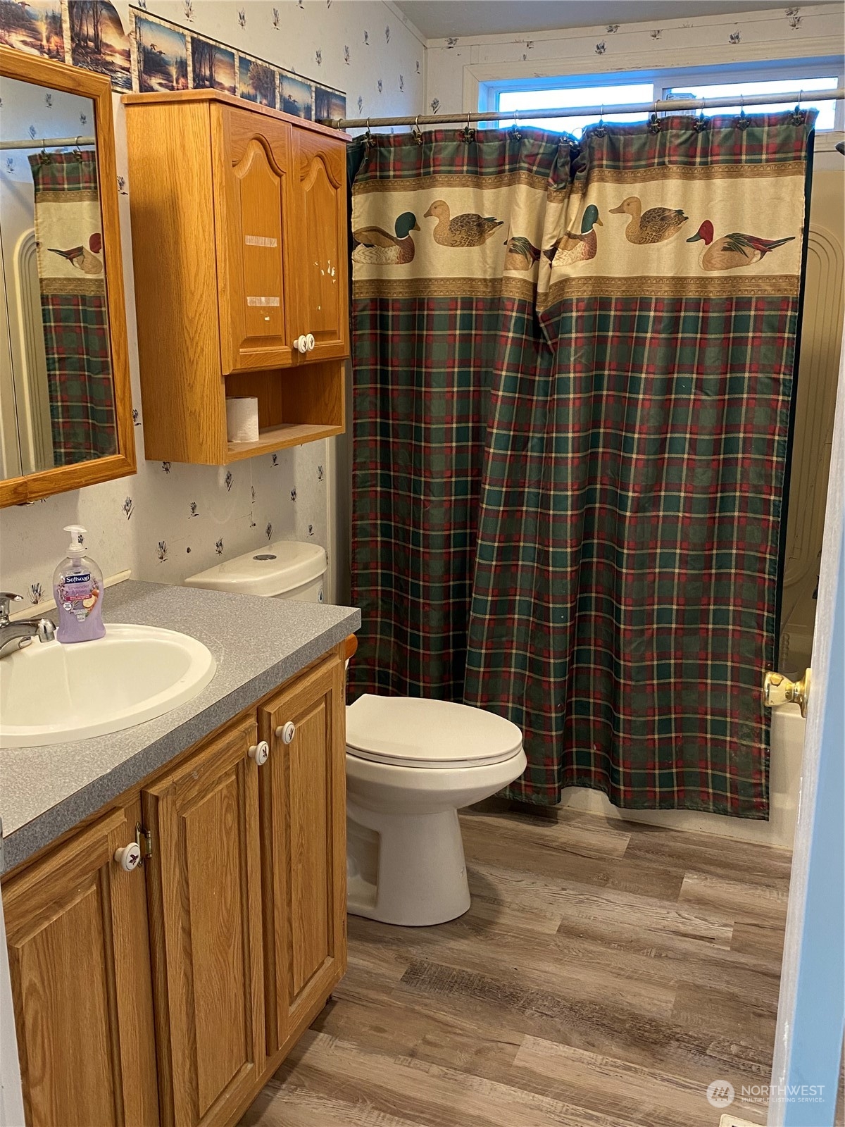 19220 Old Ranch Lane Southwest Rochester, WA 98579 - Photo 18 of 19 a bathroom with a sink toilet and shower