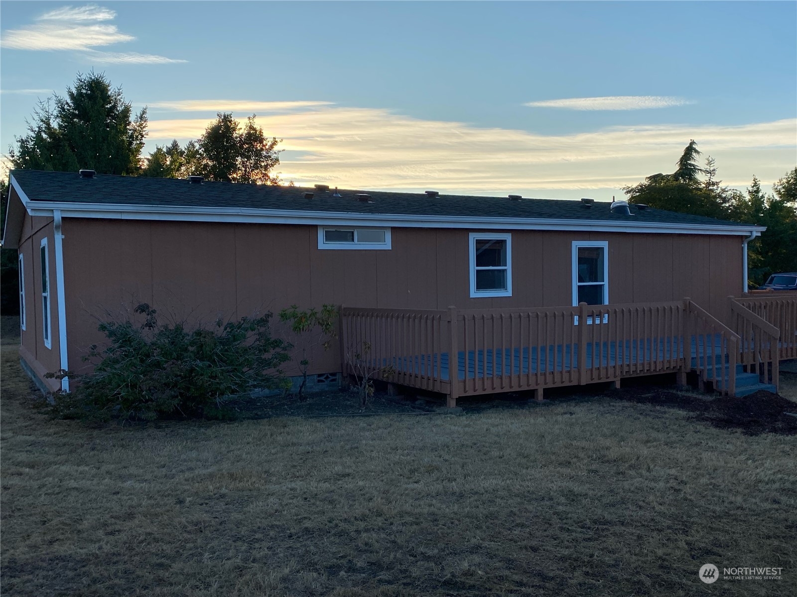 19220 Old Ranch Lane Southwest Rochester, WA 98579 - Photo 5 of 19 a view of a backyard with plants and large tree