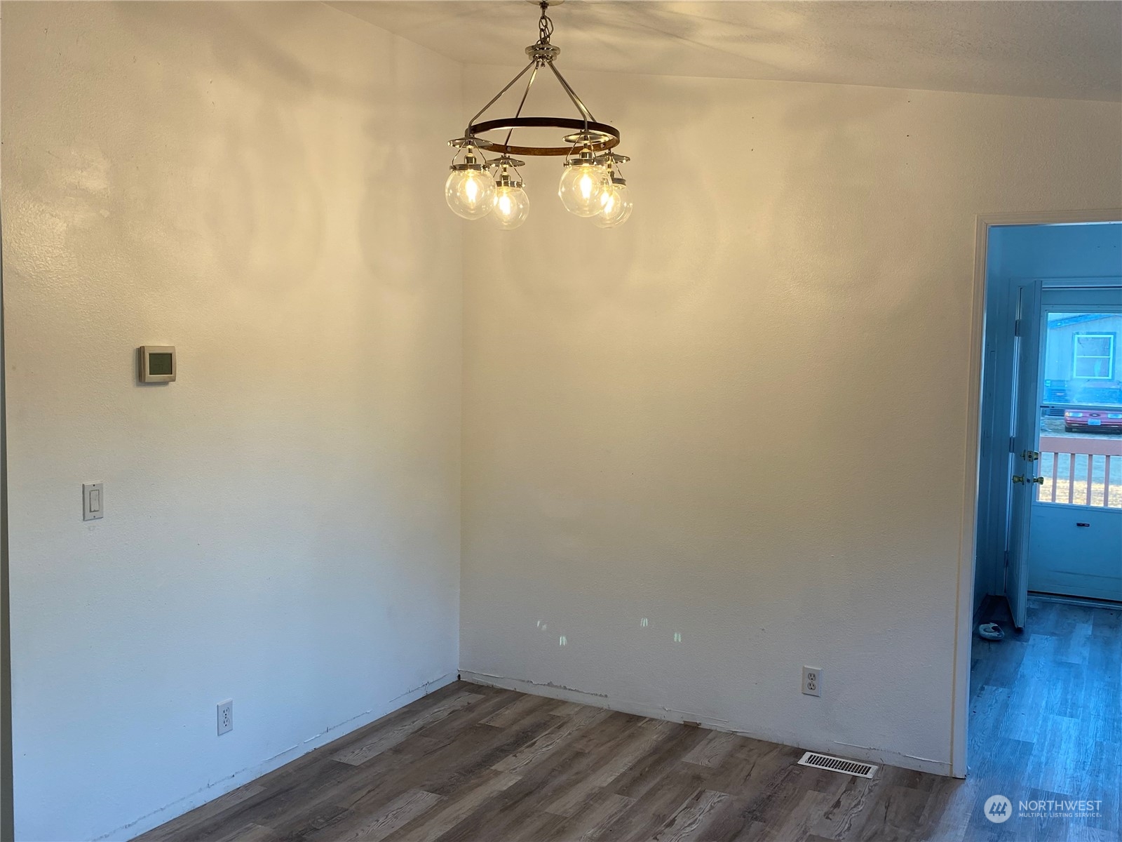 19220 Old Ranch Lane Southwest Rochester, WA 98579 - Photo 9 of 19 a view of a room with wooden floor and a window