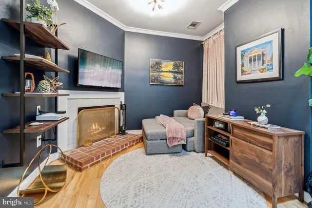 a bed room with furniture and a fireplace