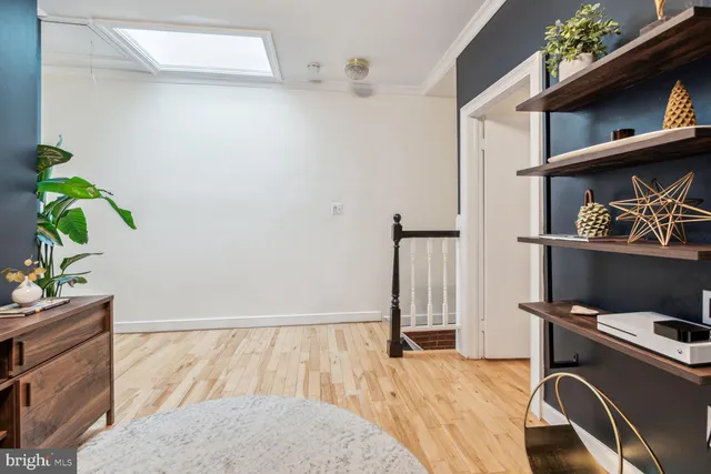 a bed room with a bed and a television