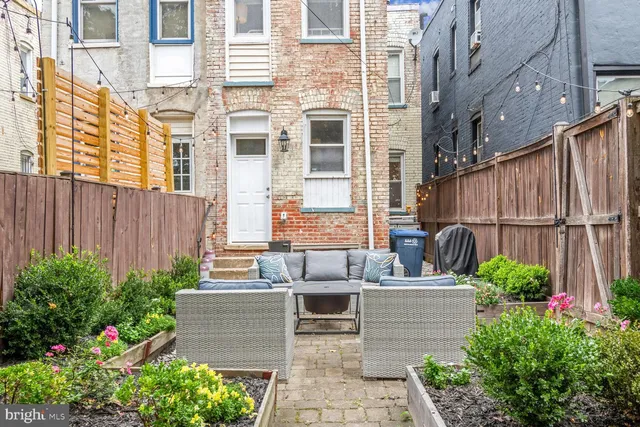 a view of a house with a flower garden