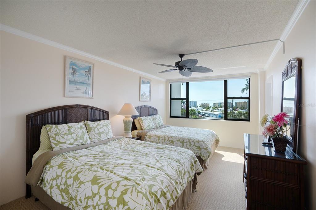 5855 Midnight Pass Road, Unit 327 Sarasota, FL 34242 - Photo 16 of 47 a bedroom with bed mirror and window