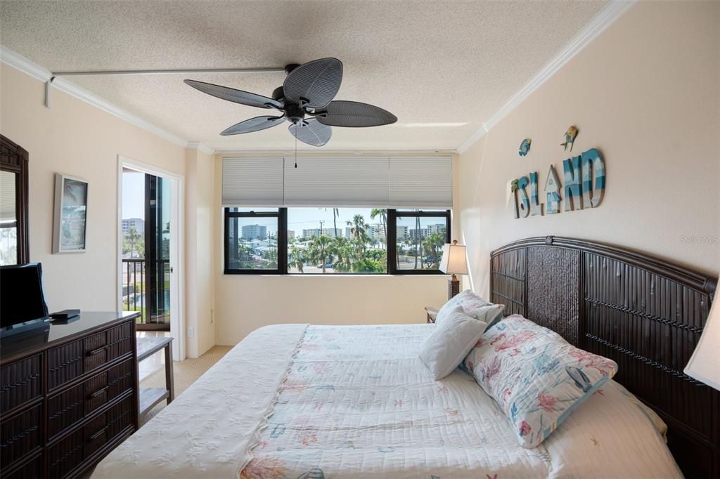 5855 Midnight Pass Road, Unit 327 Sarasota, FL 34242 - Photo 20 of 47 a bedroom with a large bed and a window