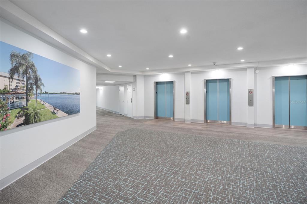 5855 Midnight Pass Road, Unit 327 Sarasota, FL 34242 - Photo 27 of 47 a view of a big room with stainless steel appliances kitchen island sink and refrigerator