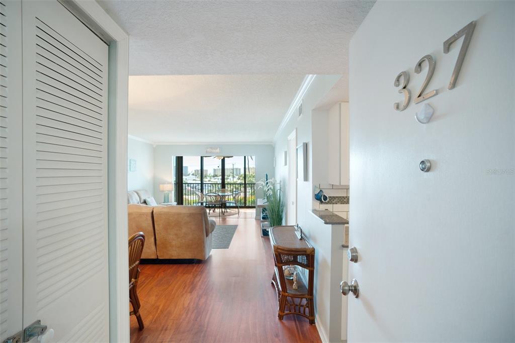 5855 Midnight Pass Road, Unit 327 Sarasota, FL 34242 - Photo 3 of 47 a living room with furniture and a large window
