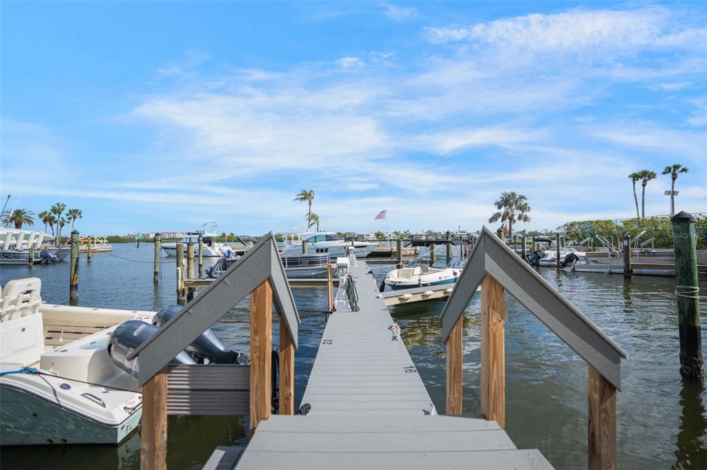 5855 Midnight Pass Road, Unit 327 Sarasota, FL 34242 - Photo 38 of 47 a view of a balcony with chairs