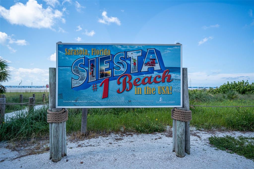 5855 Midnight Pass Road, Unit 327 Sarasota, FL 34242 - Photo 43 of 47 a sign that is on the side of the road
