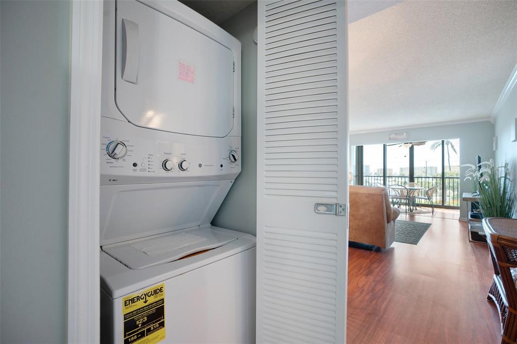 5855 Midnight Pass Road, Unit 327 Sarasota, FL 34242 - Photo 8 of 47 a living room with furniture and a floor to ceiling window