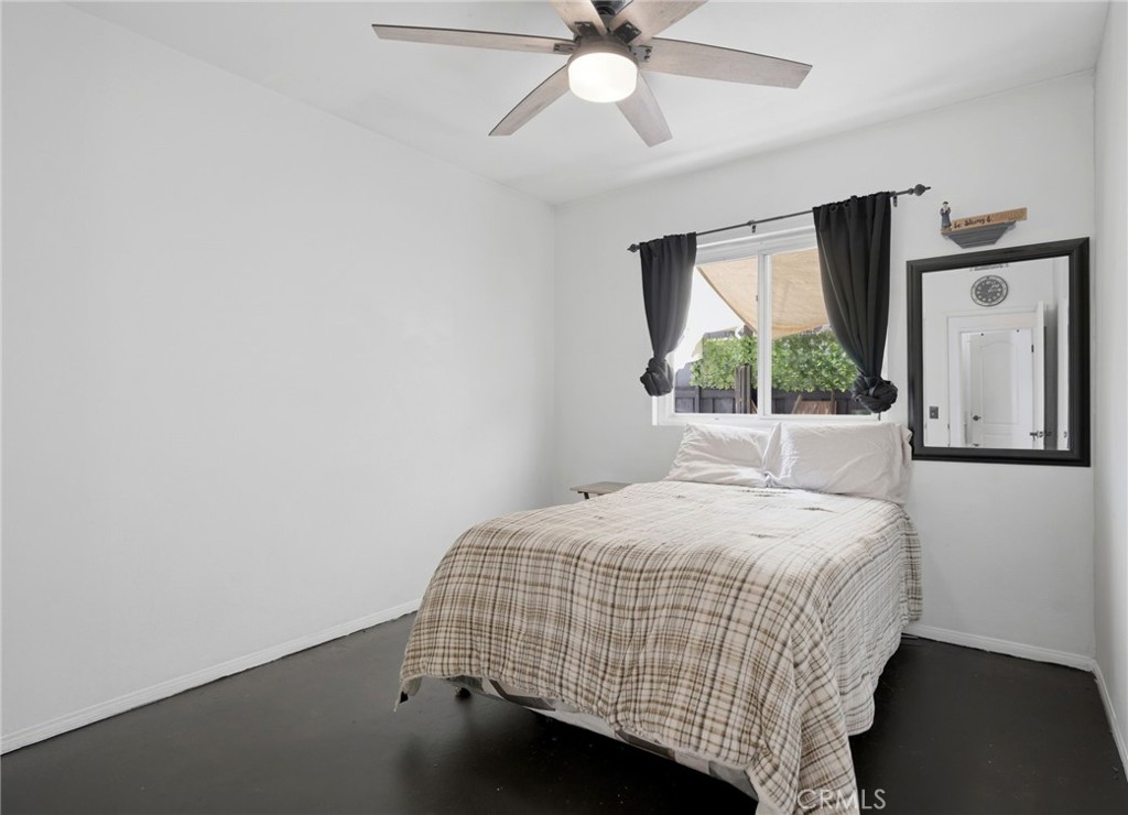 1853 Rue Chablis San Jacinto, CA 92583 - Photo 15 of 27 a bedroom with a bed and window