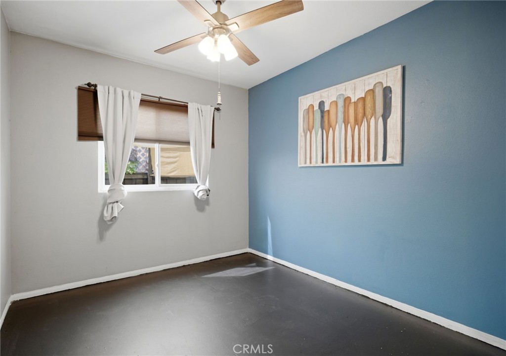 1853 Rue Chablis San Jacinto, CA 92583 - Photo 16 of 27 an empty room with windows and fan