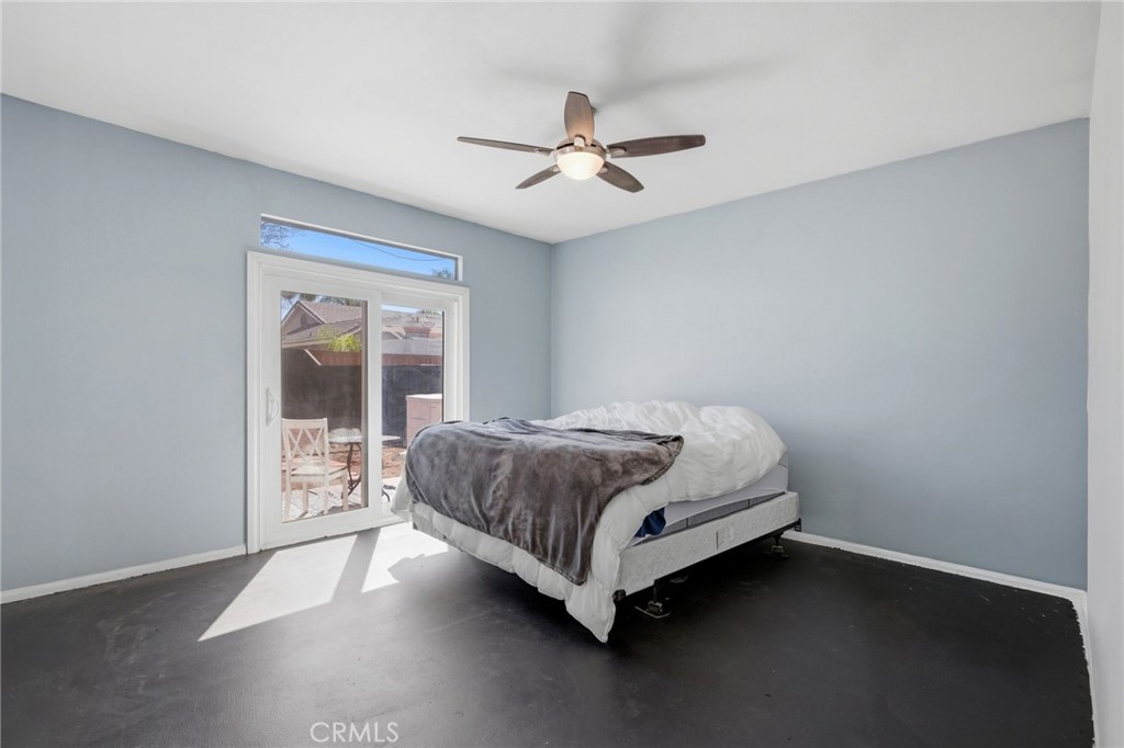 1853 Rue Chablis San Jacinto, CA 92583 - Photo 18 of 27 a bedroom with a bed and window
