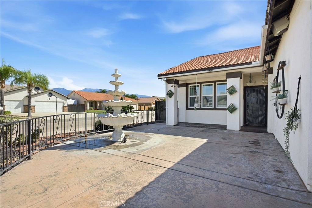 1853 Rue Chablis San Jacinto, CA 92583 - Photo 3 of 27 a view of a house with wooden floor and a fence