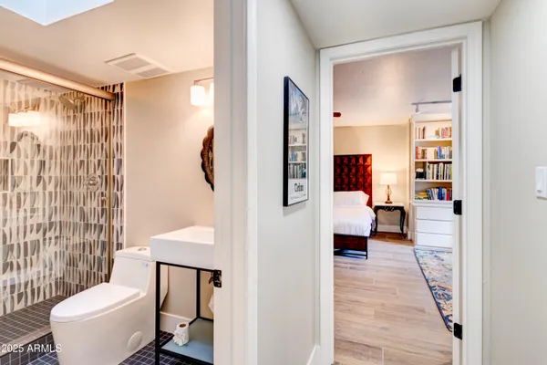 a living room with furniture and a mirror