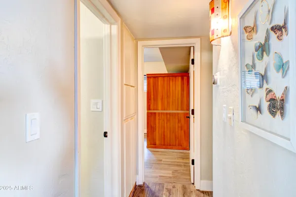 a view of a balcony with chairs and potted plants