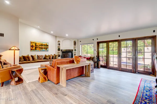a view of a living room with furniture and air hockey table