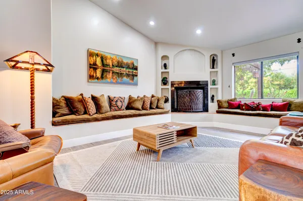 a room with furniture pool table and windows