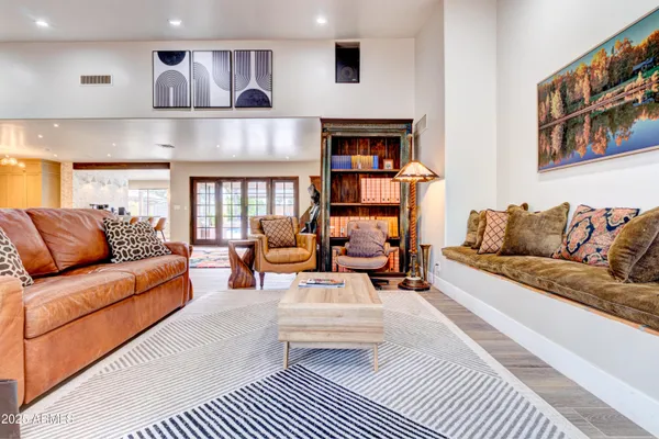 a room with gym equipment and a chandelier