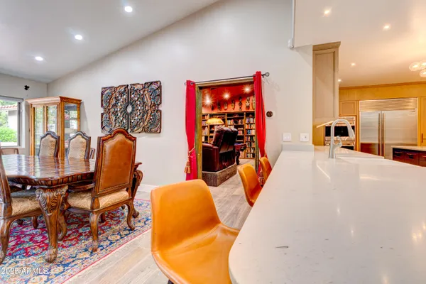 a view of a dining room with furniture and wooden floor
