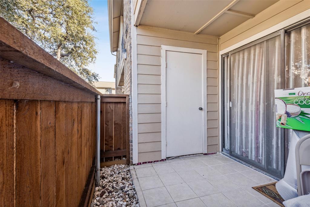 4748 Old Bent Tree Lane, Unit 1901 Dallas, TX 75287 - Photo 14 of 26 a view of room with a door and wooden walls
