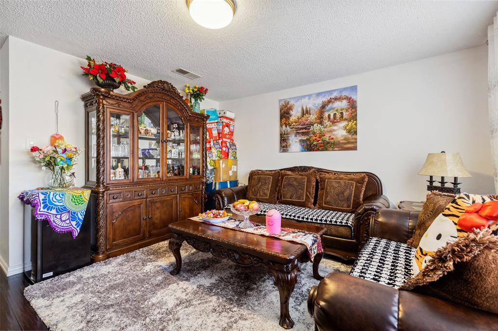 4748 Old Bent Tree Lane, Unit 1901 Dallas, TX 75287 - Photo 4 of 26 a living room with furniture and a couch