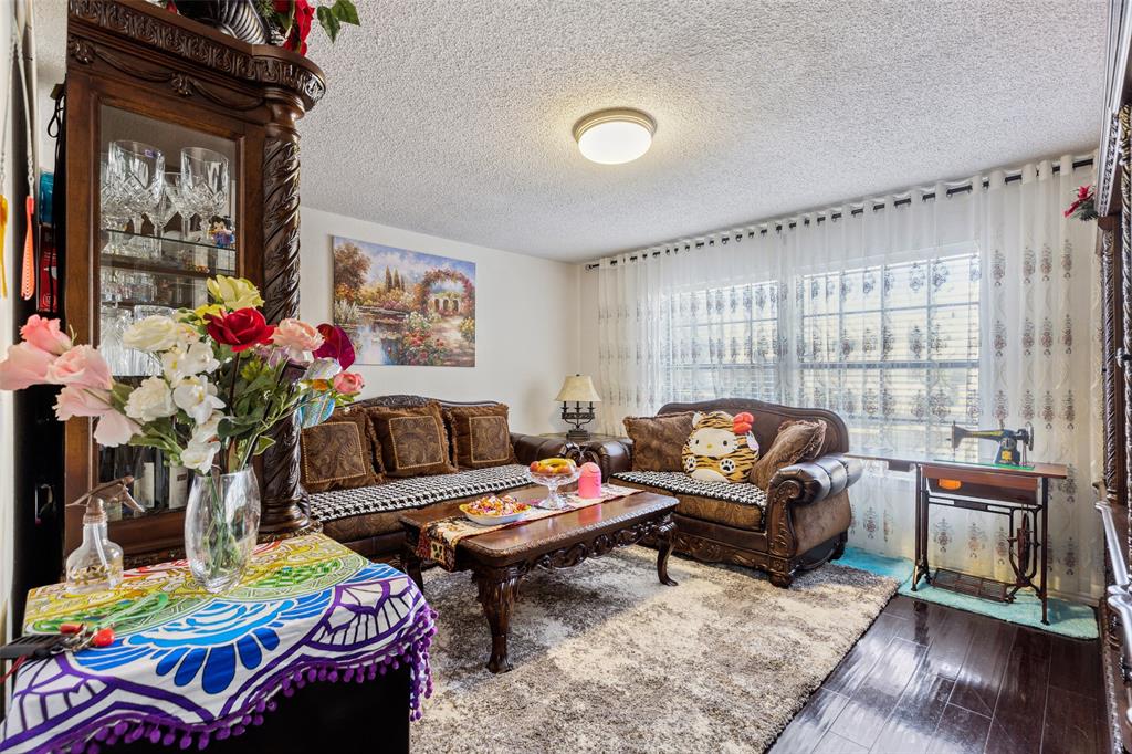 4748 Old Bent Tree Lane, Unit 1901 Dallas, TX 75287 - Photo 5 of 26 a living room with furniture and a window