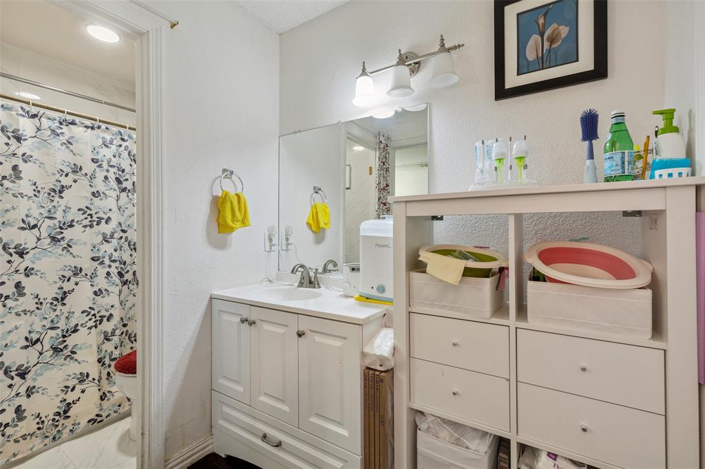 4748 Old Bent Tree Lane, Unit 1901 Dallas, TX 75287 - Photo 9 of 26 a utility room with a washer dryer and sink