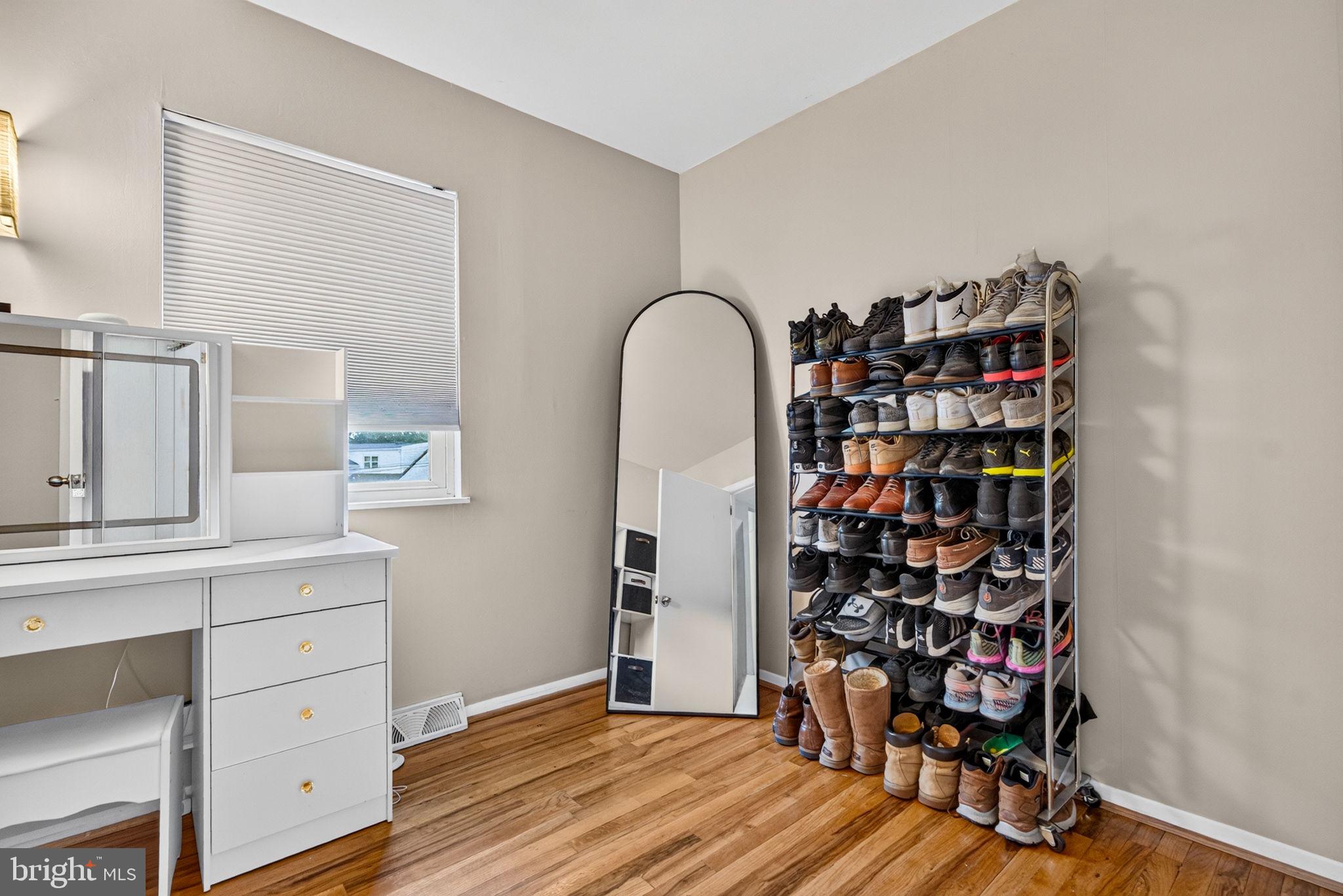 12 Woodbridge Road Gibbsboro, NJ 08026 - Photo 26 of 45 a room with a wooden floor and shelf